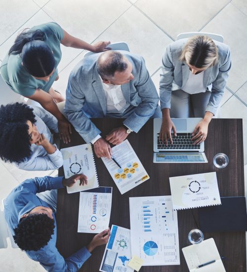 Conference team, table and discussion about documents at corporate meeting for data development. An.